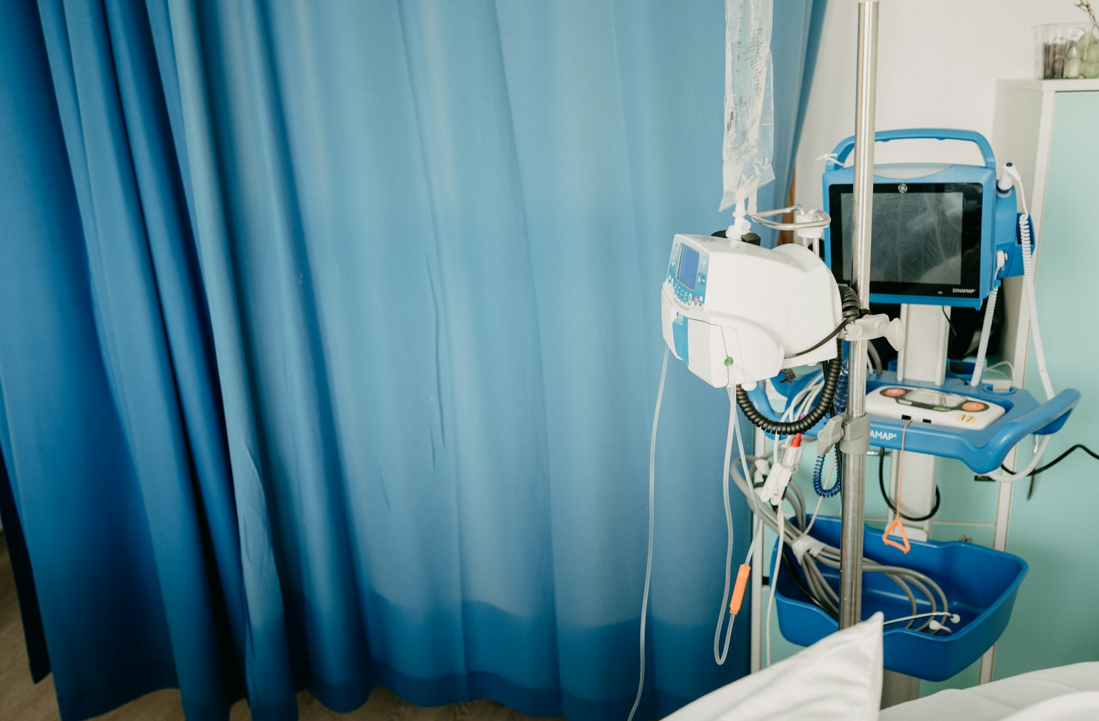 Hospital equipment and blue privacy curtains